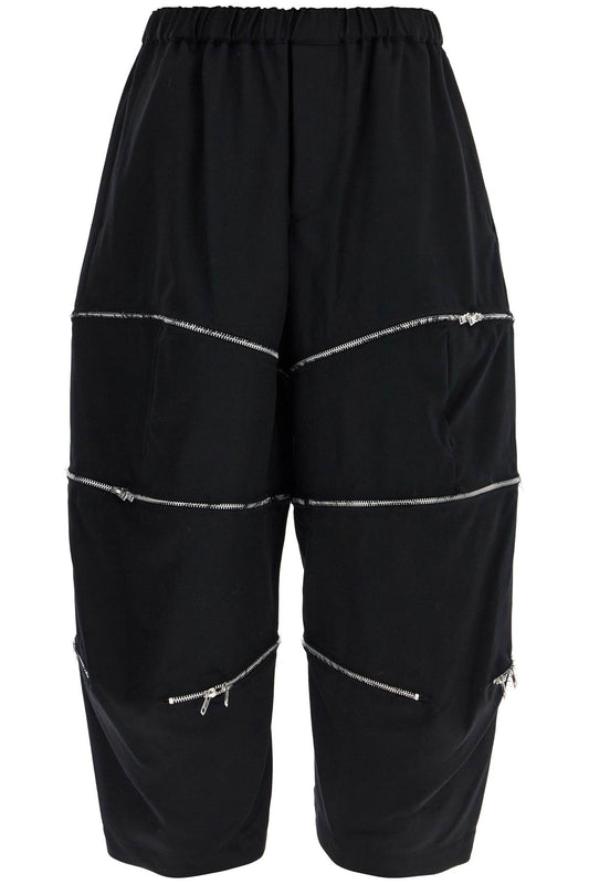 COMME DES GARCONS BLACK COMME DES GARCONS BLACK cropped pants with zip openings.