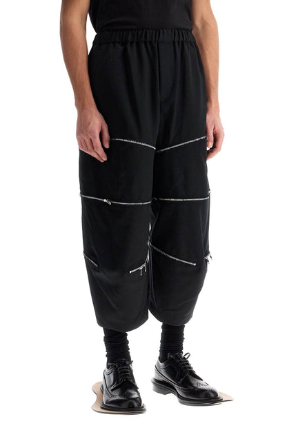 COMME DES GARCONS BLACK COMME DES GARCONS BLACK cropped pants with zip openings.