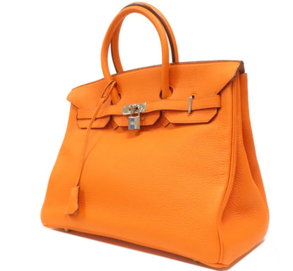 HERMÈS 
Taurillon Clemence Birkin 35 Orange (pre-loved)