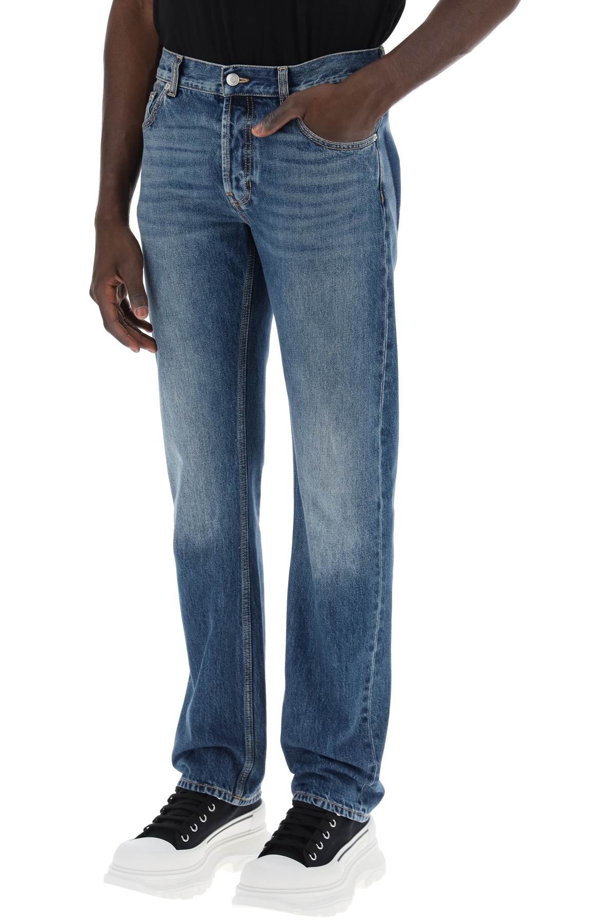 Alexander Mcqueen straight leg jeans with faux pocket on the back.